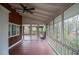 Cozy screened porch with wood paneling, ceiling fan and views to the outdoors and the wooden deck at 970 Winding Creek Trl, Sandy Springs, GA 30328