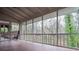 Enclosed porch features a wood floor and screens all around, providing an airy view to the outside at 970 Winding Creek Trl, Sandy Springs, GA 30328