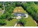 Aerial view of luxury home with large lot surrounded by mature trees in a beautiful neighborhood at 2305 Braselton Hwy, Buford, GA 30519