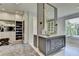 Bathroom featuring a large vanity and mirror, access to the walk-in closet, and a jacuzzi tub at 2305 Braselton Hwy, Buford, GA 30519