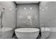 A stylish bathroom showcasing a modern stand alone tub and luxurious tile at 2305 Braselton Hwy, Buford, GA 30519