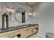 Stylish bathroom featuring a round mirror, marble wall tiles, and vanity at 2305 Braselton Hwy, Buford, GA 30519