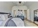 Comfortable bedroom featuring wood floors, vaulted ceilings, and statement light fixture at 2305 Braselton Hwy, Buford, GA 30519