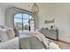 Relaxing bedroom with vaulted ceiling, large window, light grey walls and wood floors at 2305 Braselton Hwy, Buford, GA 30519