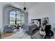 Bright bedroom with a large arch window overlooking the yard at 2305 Braselton Hwy, Buford, GA 30519