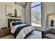 A modern bedroom features a large window with view, stylish decor, and neutral tones at 2305 Braselton Hwy, Buford, GA 30519