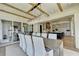 Elegant dining room featuring a large wooden table, modern chandelier, and open floor plan at 2305 Braselton Hwy, Buford, GA 30519