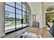 Spacious foyer boasts hardwood floors, a large arched window, and a view of the expansive front yard at 2305 Braselton Hwy, Buford, GA 30519