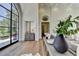 Inviting foyer with hardwood floors, arched window, and stylish console table with decorative accents at 2305 Braselton Hwy, Buford, GA 30519