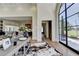 Bright foyer with hardwood floors, large arched window, and open access to the kitchen and living area at 2305 Braselton Hwy, Buford, GA 30519