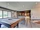 Large game room showcasing a pool table, ping pong table and an adjacent theater room at 2305 Braselton Hwy, Buford, GA 30519