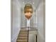 Hallway with staircase and an elegant chandelier at 2305 Braselton Hwy, Buford, GA 30519