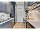 Modern kitchen with dark cabinets, marble countertops, stainless steel appliances, and subway tile backsplash at 2305 Braselton Hwy, Buford, GA 30519
