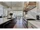 Open concept kitchen features stainless steel appliances and adjoins the dining area at 2305 Braselton Hwy, Buford, GA 30519