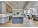 Modern kitchen with large island, custom cabinets, and stainless steel appliances at 2305 Braselton Hwy, Buford, GA 30519