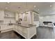 Open concept kitchen with stainless steel sink and views of the living room at 2305 Braselton Hwy, Buford, GA 30519