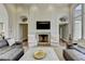 Cozy living room with fireplace, neutral decor, and comfortable seating arrangements at 2305 Braselton Hwy, Buford, GA 30519