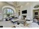 Elegant living room with fireplace, comfortable seating, and abundant natural light at 2305 Braselton Hwy, Buford, GA 30519