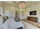 Luxurious main bedroom featuring a decorative tray ceiling and hardwood floors at 2305 Braselton Hwy, Buford, GA 30519