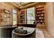 A well-lit office with built-in bookshelves and an executive desk at 2305 Braselton Hwy, Buford, GA 30519
