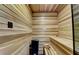 Wood-paneled sauna with built-in bench, heater, and traditional design at 2305 Braselton Hwy, Buford, GA 30519