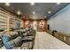 Home theater featuring plush seating, tiered levels, and movie posters on the wall at 2305 Braselton Hwy, Buford, GA 30519