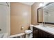 Neat bathroom with a shower, toilet, dark wood vanity, and a light countertop at 3135 Reeves Se St, Smyrna, GA 30080