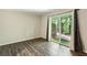 Bedroom with wood flooring, neutral paint, and sliding glass doors leading to outdoor space at 3135 Reeves Se St, Smyrna, GA 30080