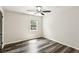 Spacious bedroom features hardwood floors, an overhead fan, and a window at 3135 Reeves Se St, Smyrna, GA 30080