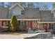 Charming townhome featuring a brick facade, well-maintained landscaping, and a welcoming entrance at 3135 Reeves Se St, Smyrna, GA 30080