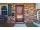 Front exterior with brick and a red colored security door at 3135 Reeves Se St, Smyrna, GA 30080