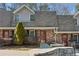 Traditional brick townhome with well-maintained landscaping and charming front entryway at 3135 Reeves Se St, Smyrna, GA 30080