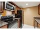 Functional kitchen featuring stainless steel appliances and wood cabinetry at 3135 Reeves Se St, Smyrna, GA 30080