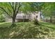 Green backyard with a deck and a wooden fence at 3310 Chartwell Blvd, Suwanee, GA 30024