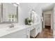 Bathroom features double vanity, white cabinets, and walk-in closet access at 3310 Chartwell Blvd, Suwanee, GA 30024