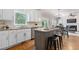 Bright kitchen features white cabinetry, granite countertops and stainless steel appliances at 3310 Chartwell Blvd, Suwanee, GA 30024