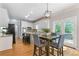 Bright eat-in kitchen featuring white cabinets, stainless appliances, and access to a deck at 3310 Chartwell Blvd, Suwanee, GA 30024