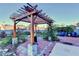 Backyard with a charming pergola, brick patio, and potential garden space for outdoor enjoyment at 3431-0 Tioga Lake Cv, Lawrenceville, GA 30044