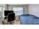 Bedroom with neutral carpet and walls, window, desk, tv and a bed at 3431-0 Tioga Lake Cv, Lawrenceville, GA 30044