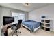 Bedroom with neutral carpet and walls, window, desk, tv and a bed at 3431-0 Tioga Lake Cv, Lawrenceville, GA 30044