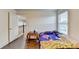 Bedroom with a hardwood floor, a window, and a door at 3431-0 Tioga Lake Cv, Lawrenceville, GA 30044