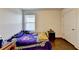 Bedroom with a hardwood floor, a window, and a door at 3431-0 Tioga Lake Cv, Lawrenceville, GA 30044