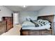Bedroom with carpeted floors, gray-blue walls, a ceiling light, and a decorative automotive decal on the wall at 3431-0 Tioga Lake Cv, Lawrenceville, GA 30044