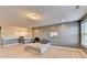 Large bonus room area with neutral colored walls and carpeted floors at 3431-0 Tioga Lake Cv, Lawrenceville, GA 30044