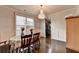 Elegant dining area featuring a chandelier and large window with natural light at 3431-0 Tioga Lake Cv, Lawrenceville, GA 30044