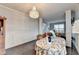 Dining room with hardwood floors and a decorative chandelier at 3431-0 Tioga Lake Cv, Lawrenceville, GA 30044