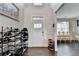 Bright foyer with dark hardwood floors and a view into the adjacent living room at 3431-0 Tioga Lake Cv, Lawrenceville, GA 30044