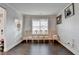 Cozy living room with natural light, dark hardwood floors, and decorative trim at 3431-0 Tioga Lake Cv, Lawrenceville, GA 30044