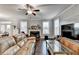 Open living room showcasing hardwood floors and a fireplace at 3431-0 Tioga Lake Cv, Lawrenceville, GA 30044
