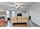 Open living room with hardwood floors and a ceiling fan at 3431-0 Tioga Lake Cv, Lawrenceville, GA 30044
